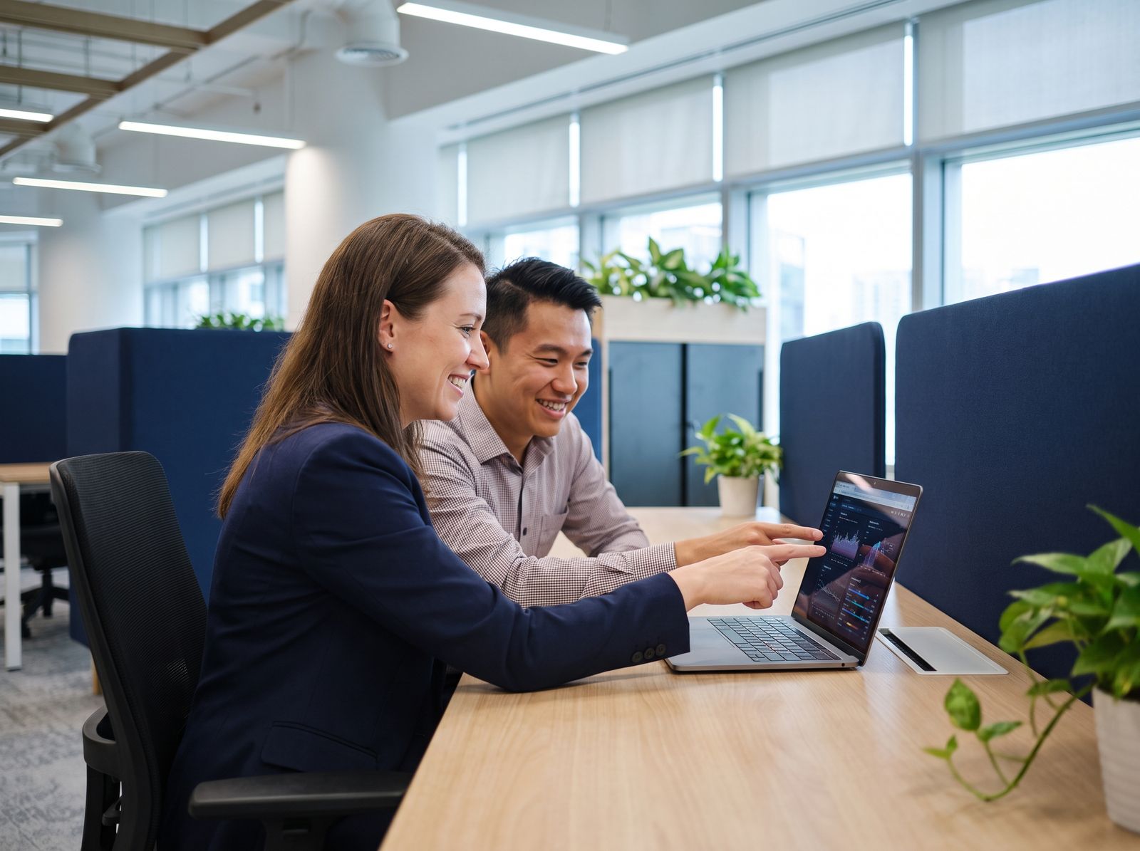 Manager and administrator reviewing an AI-generated report in Singapore